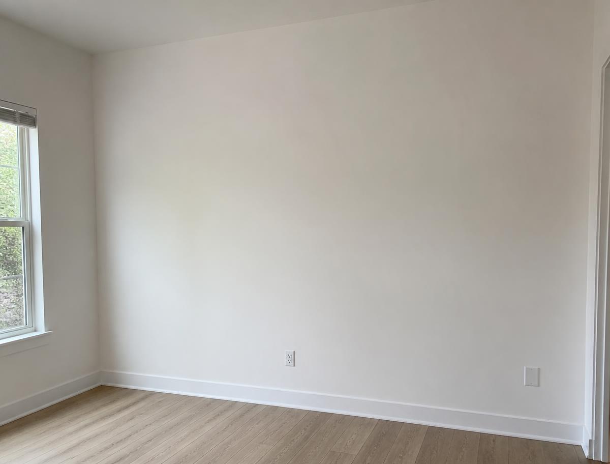Smooth repainted wall after professional drywall repair