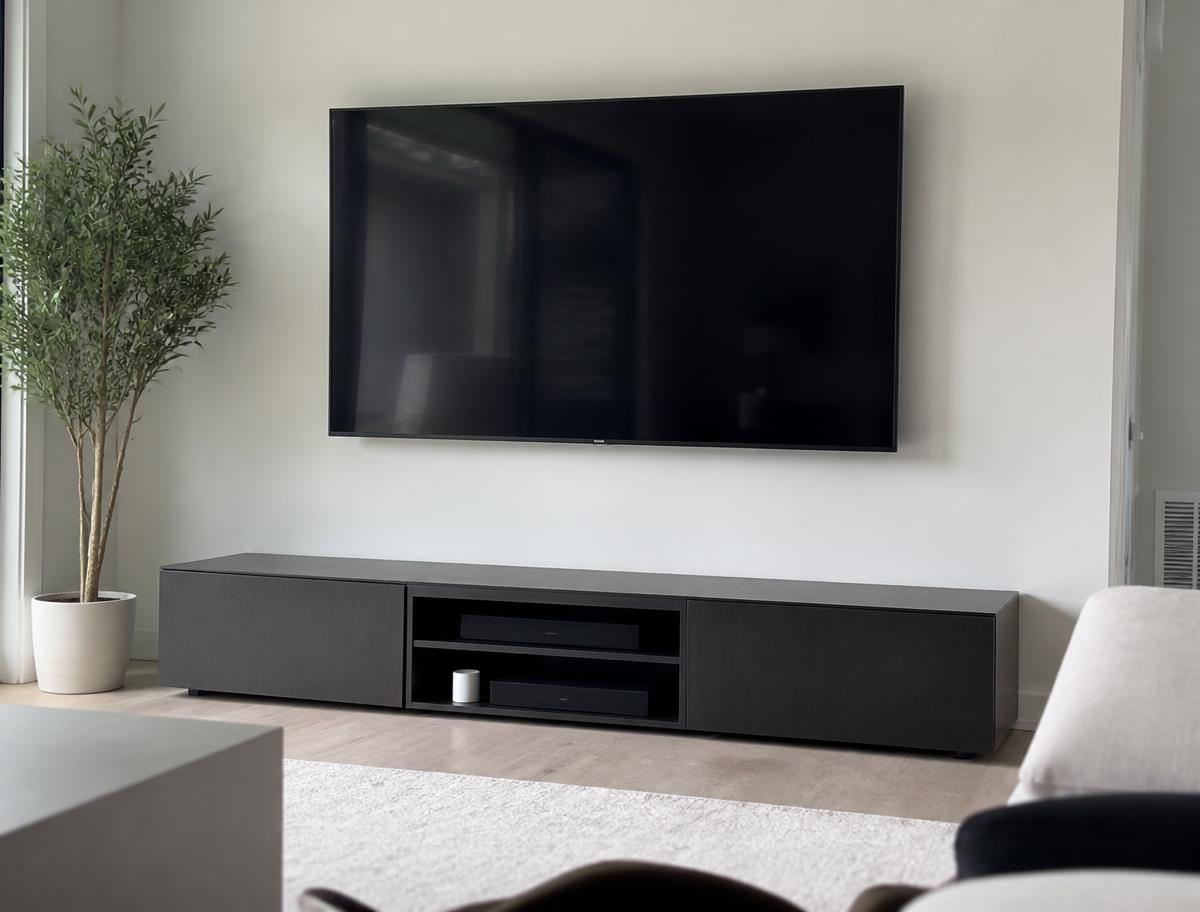 Flat screen TV cleanly wall mounted and level with cables concealed